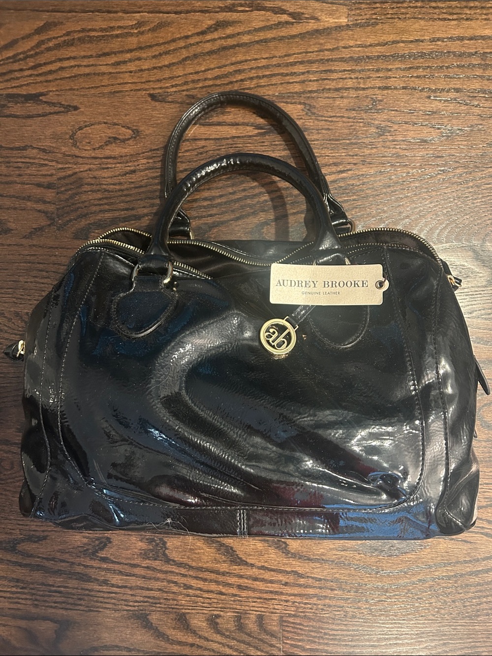Audrey Brooke Black Patent Satchel with Gold Accent